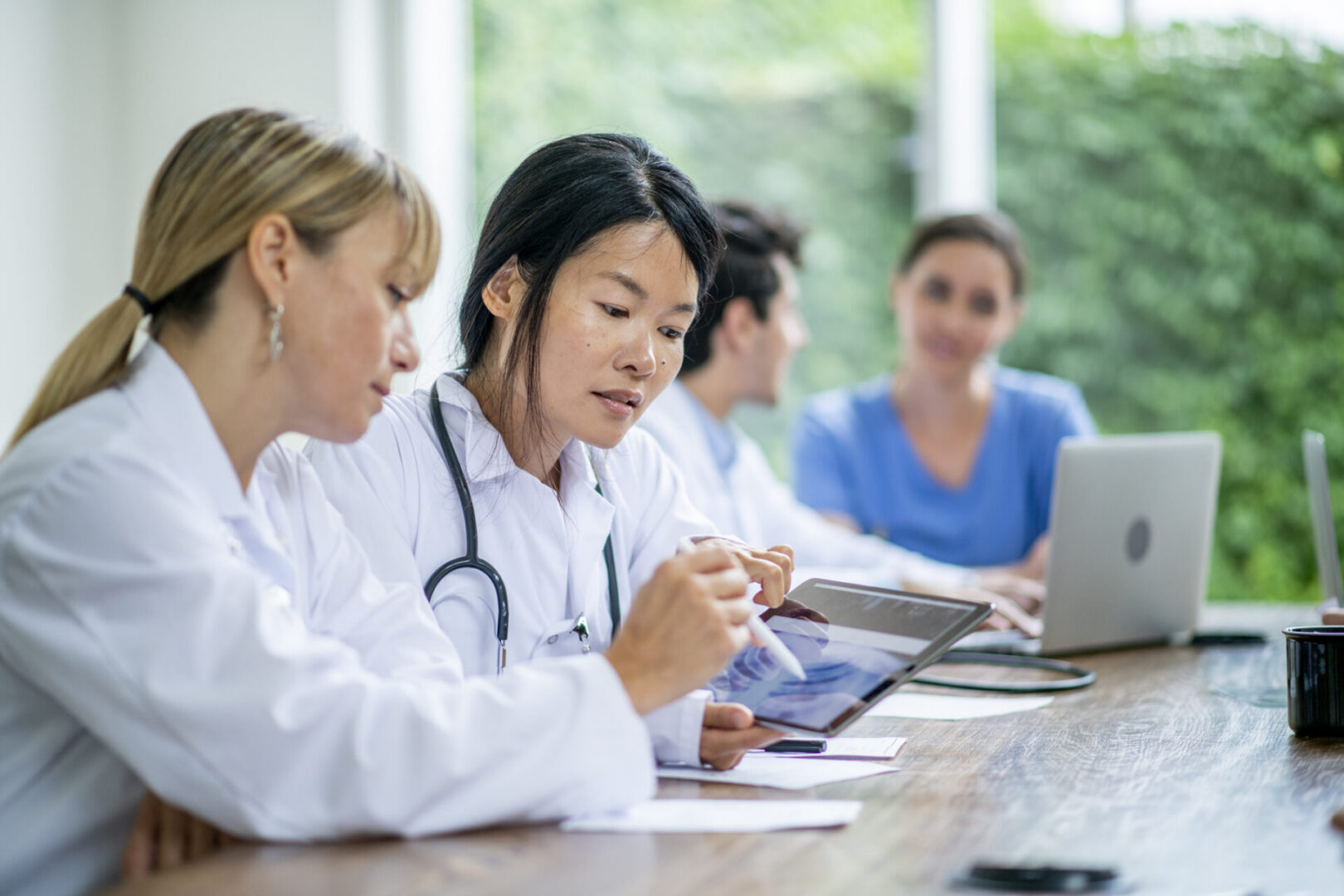 Medical professionals collaborating at a meeting