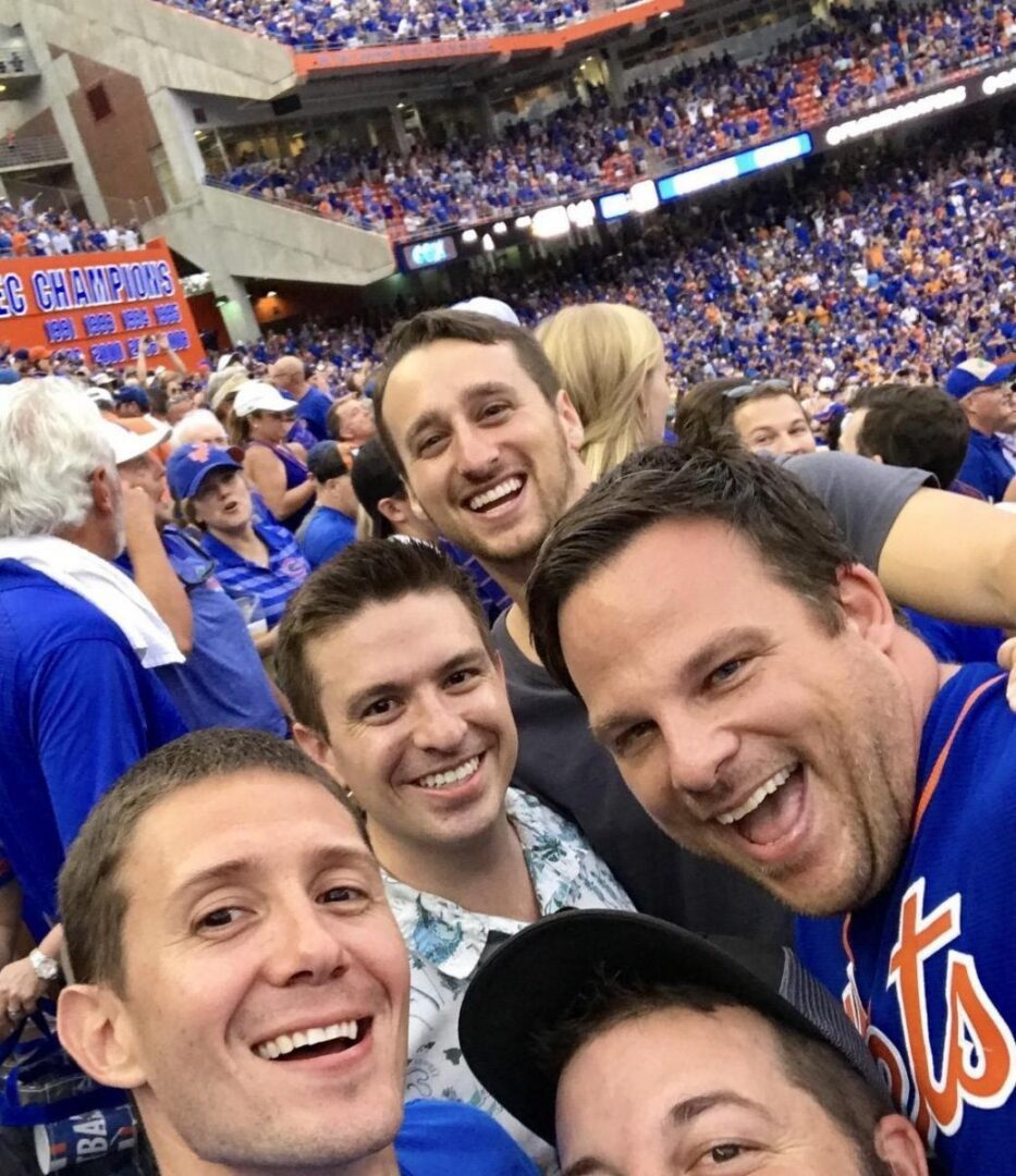 Smiling crowd wearing team jerseys
